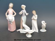 Four Lladro figures Goose Girl, Girl with Hat and two geese,