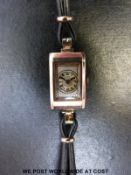 An Art Deco 9ct gold ladies wristwatch with Arabic numerals on mother of pearl effect face,