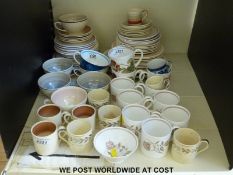A collection of Susie Cooper ceramics including coffee cups and saucers,