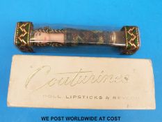 Two 'Couturines' doll lipstick cases by Revlon