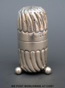 A likely Victorian hallmarked silver pepper of wrythen design, marks rubbed, height 6.