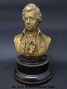 A bronze bust of Mozart on turned ebonised base,