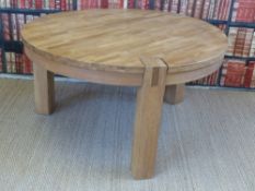 A light oak table raised on three legs