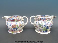 A pair of interesting mid 19thC jugs with chinoiserie scenes and 'porcelain' in script to the base