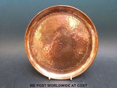 An Arts & Crafts Newlyn copper dish stamped to centre