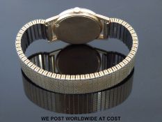 Tissot 9ct gold gentleman's wristwatch with luminous hands and two tone baton markers on brushed