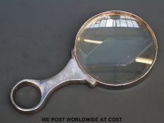 A hallmarked silver mounted magnifying glass,
