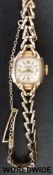 Accurist 9ct gold ladies wristwatch on 9ct gold bracelet (12.