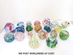 Twenty various glass paperweights all with multi-coloured designs, including fish, Team GB, etc.