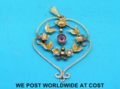 An Edwardian pendant set with garnets and seed pearls