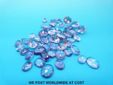 A packet of loose amethysts mainly oval cut