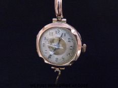 A 9ct gold ladies wristwatch with blued hands and two tone face, on 9ct gold expanding bracelet.