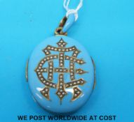 A Victorian yellow metal locket set with seed pearls on a blue enamel ground