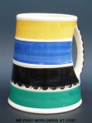 A Susie Cooper Crown Works Burslem mug or tankard with integral handle and multicoloured concentric