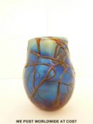 Norman Stuart Clarke glass vase with trailing decoration over iridescent blue ground, 12.