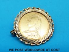 A yellow metal brooch set with a 1889 gold full sovereign (9.