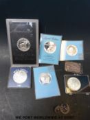 A quantity of largely silver 38mm coins to include USA dollars, Sky Lab I and II,
