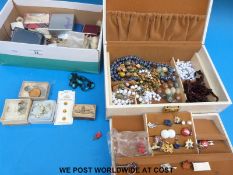 A collection of costume jewellery to include brooches, bracelets, necklaces,