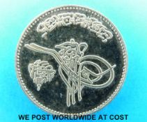A gold coin, probably Turkish,