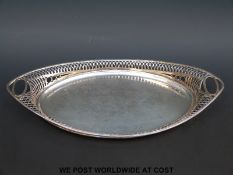 A George V hallmarked silver oval tray with pierced rim, London 1911 maker D & J Wellby Ltd.