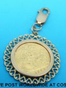 A 9ct gold pendant set with a 1982 gold half sovereign (6.