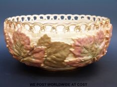 A Royal Worcester blush ivory pedestal bowl with relief moulded leaf decoration and pierced rim,