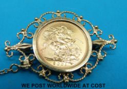 A 9ct gold brooch set with a 2001 gold half sovereign (7.