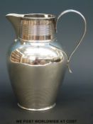 A Victorian hallmarked silver baluster shaped jug, height 16cm,