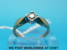 A 9ct gold ring set with a diamond in a square setting (size N)