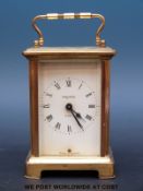A French brass cased carriage clock by Bayard with eight day movement in original box