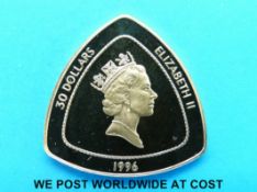 A 1996 gold proof cased 30 dollar Royal Mint Bermuda triangular coin, 15.55g. .