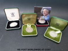 Four cases of silver commemorative crowns