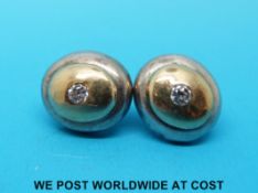 A pair of bi-coloured earrings, marked 750 (10.
