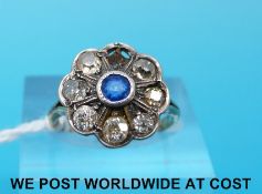 A Victorian 18ct gold ring set with a sapphire surrounded by diamonds (size K)