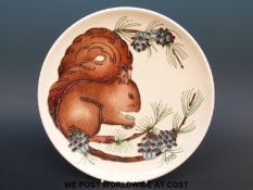 A Moorcroft plate with squirrel decoration by Rachael Bishop, limited edition 333/500 (8.
