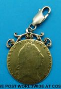 A gold George III spade guinea in pendant (10.