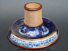 A Doulton Lambeth advertising match striker for M B Foster & Sons Ltd bottled beers (height 8cm)