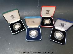 Four silver proof cased 50 pence coins, both sizes,