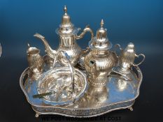 A collection of plated and brass ware including a bell marked ARP, companion set, tray,