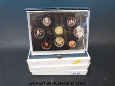 Four deluxe proof sets 1986-1989