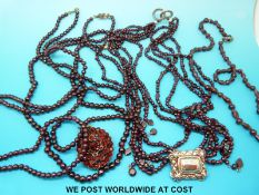 Five garnet beaded necklaces
