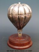 A hallmarked silver pepper grinder by Mark Stevens of Warwick in the form of a hot air balloon,