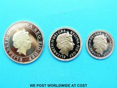 A 2003 gold proof three sovereign set includes double,