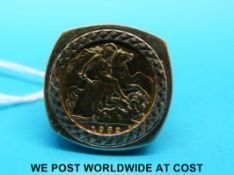 A 9ct gold ring set with a 1982 gold half sovereign (10.