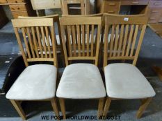 Six light oak dining chairs with upholstered seats