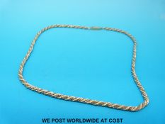A bi-coloured 9ct gold necklace in rope twist design (10.