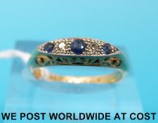An 18ct gold ring set with alternating sapphires and diamonds in a platinum setting (size N)