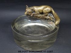 A glass dressing table or bon bon bowl with bronze fox to edge,