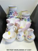 A collection of Poole pottery including medium and small vases,
