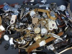 Over eighty various ladies and gentleman's wristwatches.
